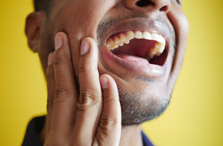 a man suffering from severe toothache